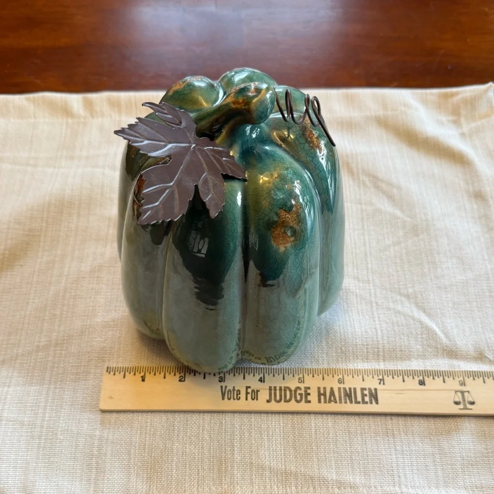 Ceramic pumpkin with metal leaf accent
